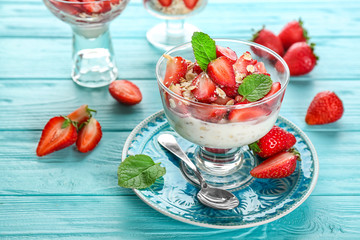Delicious dessert with fresh strawberry on table