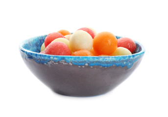 Plate with fresh melon and watermelon balls on white background