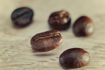 Scattered coffee grains on a wooden table