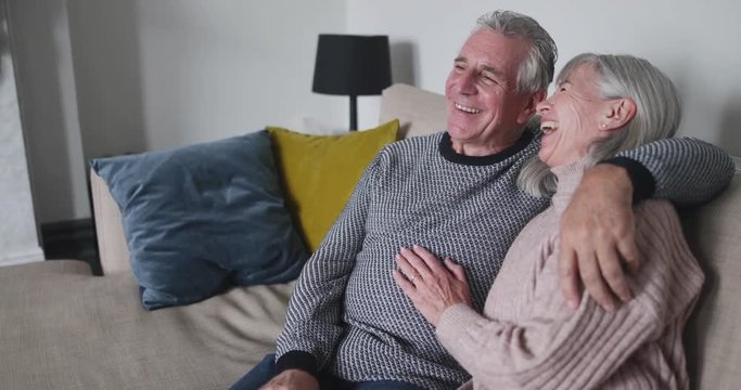 Senior couple relaxing on sofa