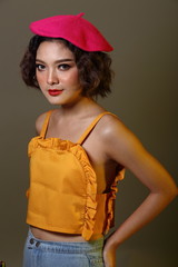 Korean Girl with freckles on face curl short hair pink cap yellow dress