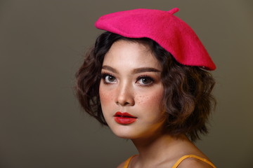 Korean Girl with freckles on face curl short hair pink cap yellow dress