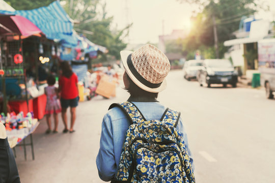 asian woman traveler shopping walking on street market