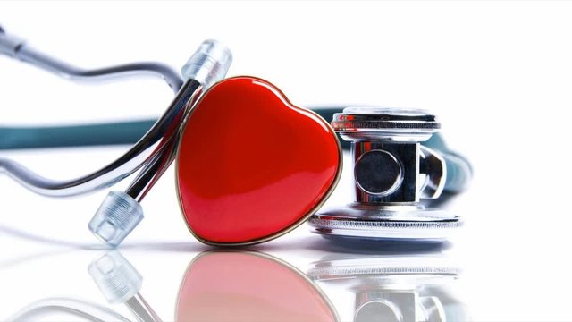 Medical cinemagraph of heart and stethoscope background
