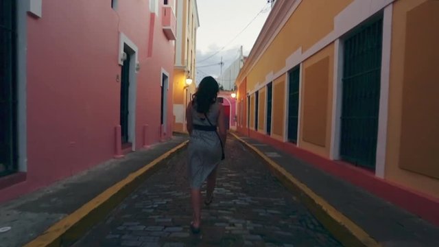Slow Motion of woman walking around beautiful streets in Old San Juan - Cuba look alike