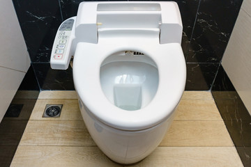 Modern high tech toilet with hygienic and high technology of the toilet bowl, automatic flush toilet - obrazy, fototapety, plakaty