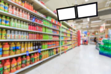 Blank supermarket TV screen and blurred supermarket drinks background