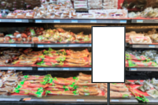 Blank billboard and blurred supermarket ham sausage background
