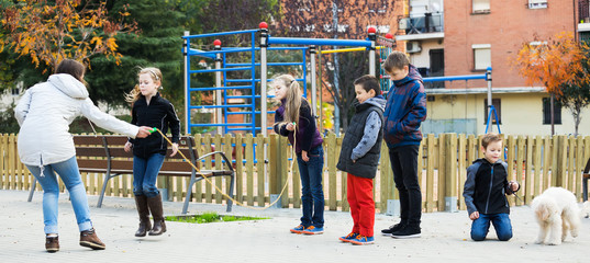 Children playing skipping rope