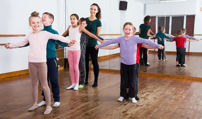 industrious little boys and girls dancing pair dance