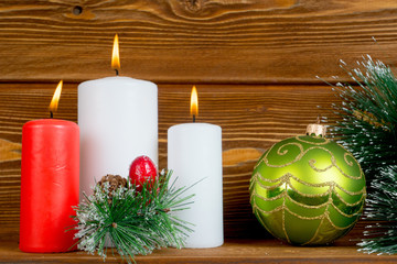 christmas composition with candles pine brunch and bauble