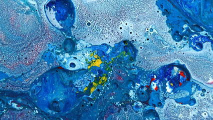 Complex blue and red and yellow and white spheres wash vibrant bright paint and oil color swirls entropy