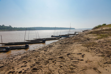 Traditional fishing boats docked at the Mekong River, Laos, Thailand, Vietnam, Cambodia.
