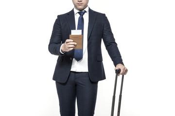 asian business man stand up with suit case, passport isolated white