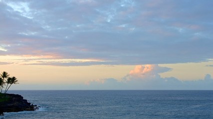 Obraz premium Sunset Rocks Clouds Kauai Hawaii