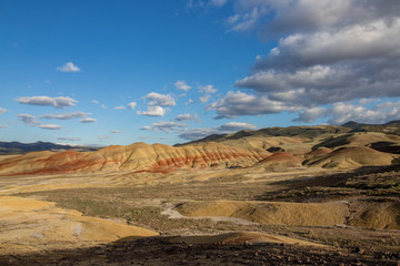 Painted Hills in spring bright with clouds