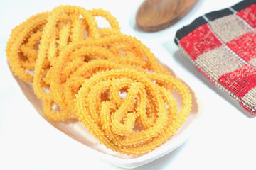 Indian savoury dish Murukku is spicy and crunchy dish prepared in South India for festivals and ceremonies.