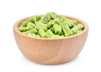 front view of slice yard long bean in wooden bowl isolated on white background