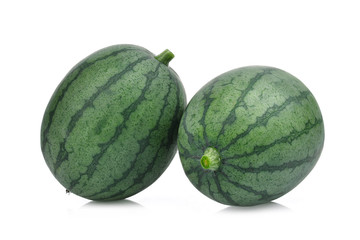 two whole young small watermelon isolated on white background