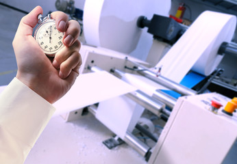 Process of paper products manufacturing and stopwatch in hand