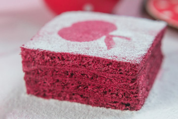 Fruit nosugar pastila, apple paste marshmallow as layered pie sprinkle with sugar powder, traditional Russian pie, isolated on the table background