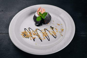 Chocolate Biscuit Baking with Ice Cream. Dessert. On a wooden surface. Top view. Free space for your text.