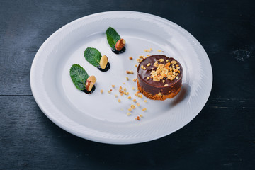 Walnuts and Chocolate Baking. On a wooden surface. Top view. Free space for your text.