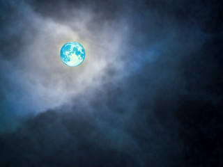 full blue moon on dark blue cloud and night sky