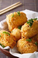 Japanese food: potato croquettes close-up. vertical