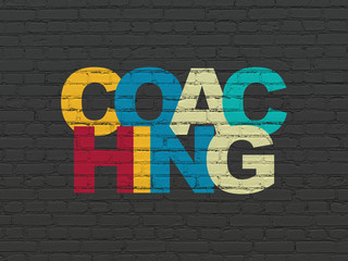 Learning concept: Painted multicolor text Coaching on Black Brick wall background