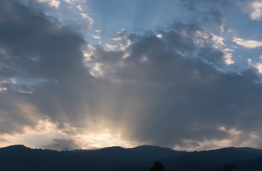 ray of light. sunbeam at sunset with mountain landscape.