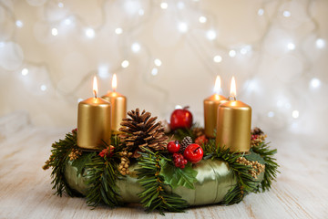 Obraz na płótnie Canvas Advent wreath with burning candles for the Christmas time