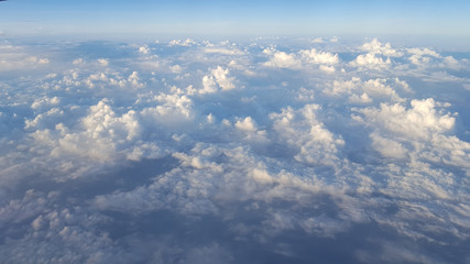Beautiful scenic view of clouds  and blue sky from an airplane.