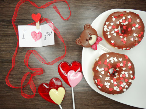 valentine's day chocolate donuts teddy bear and greeting card