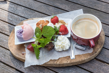 Gourmet coffee. Cup of coffee, cakes, fruits, ice cream.