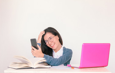 Young asian business woman wearing glasses talking on phone with copy space background - Vintage Light Effect added