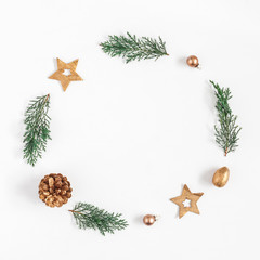Fototapeta na wymiar Christmas composition. Christmas wreath made of fir branches, balls, pine cones on white background. Flat lay, top view, copy space, square
