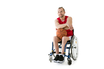 Fototapeta na wymiar sportsman in wheelchair with basketball ball