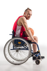 sportsman in wheelchair with basketball
