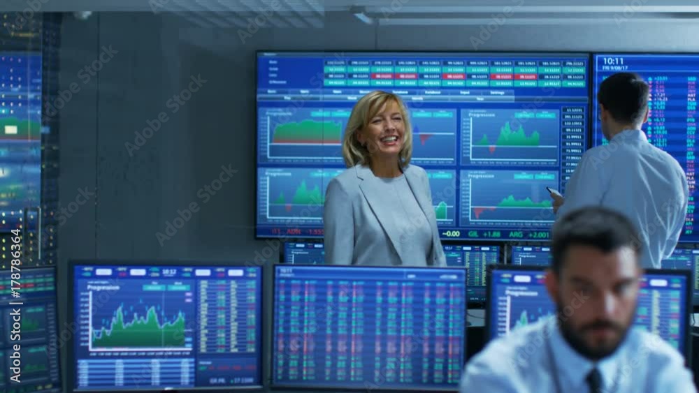 Poster top manager enters stock market operating room greeting traders and brokers. room is full of monitor