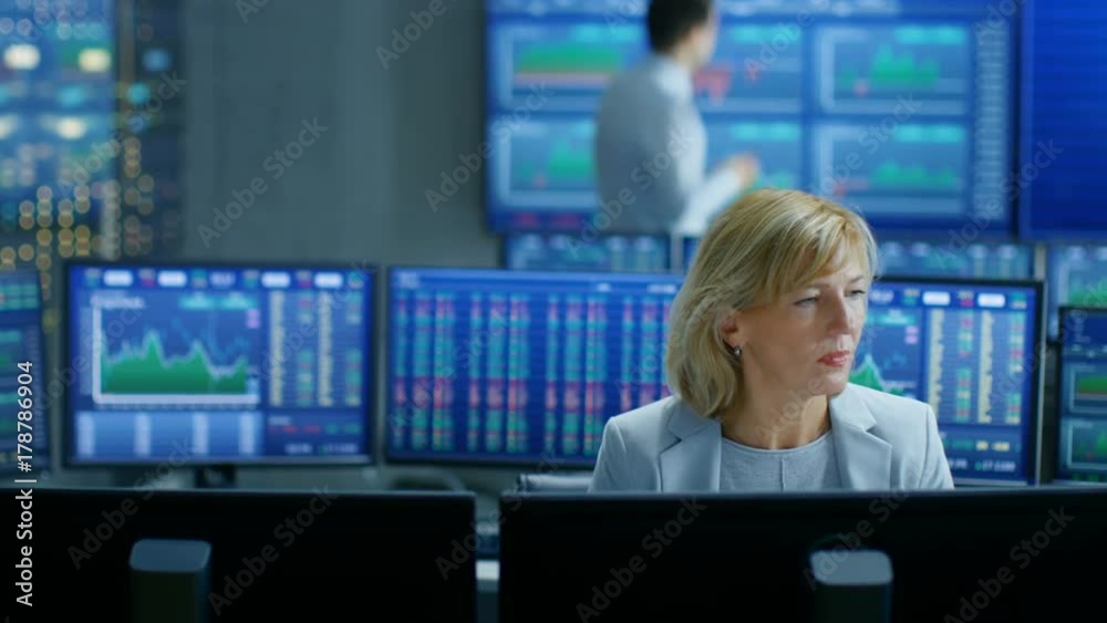 Aufkleber young trader walks into market exchange room, senior sales force representative works on her compute