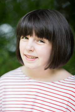 Outdoor Head And Shoulder Portrait Of Smiling Pre Teen Girl