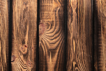 Texture of boards of dark old brown wood