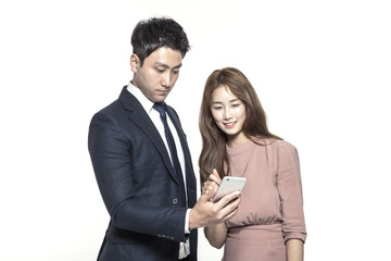 business man and woman standing up with smart device isolated white.