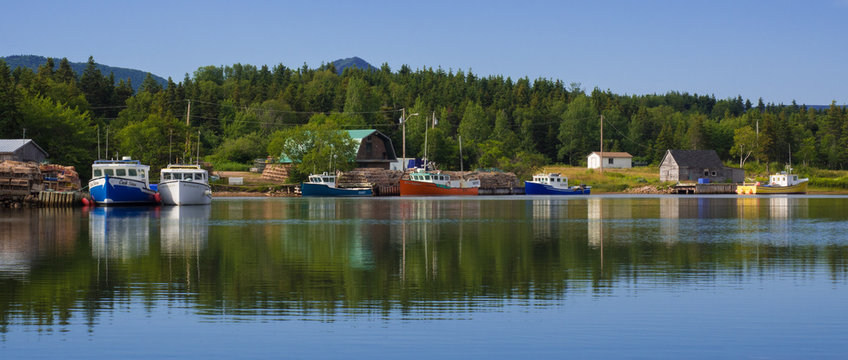 A group of colourful fishing boats from a picturesque fishing village in Nosa Scotia