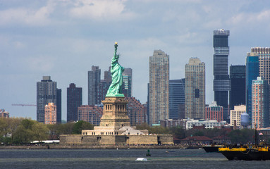 Statue of Liberty. New York, panorama of Manhattan with the One World Trade Center (Freedom Tower) and Hudson River, USA