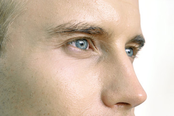 Lasik , contact lens ,  Eye diseases concept. Close up of male face , eyes and nose.