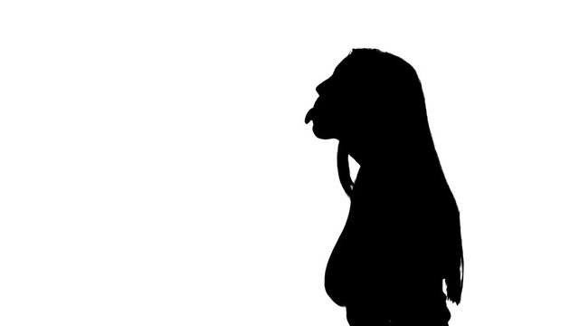 Girl sticks her tongue out silhouette