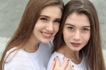 Close-up portrait of two beautiful girls