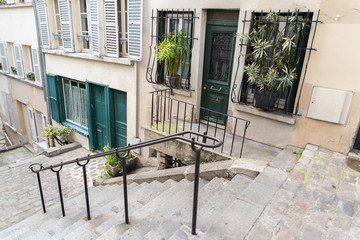     Typical alley in Montmartre, romantic staircases in Paris 
